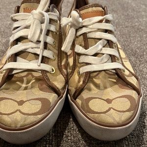 Coach tennis shoes size 10B colors in browns.